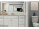 Modern bathroom with a white vanity, neutral countertop, and a separate toilet area at 3823 Horsham St, Indian Land, SC 29707