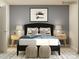 Well-designed bedroom includes a dark bed frame, stylish nightstands, and decorative wall art at 3823 Horsham St, Indian Land, SC 29707