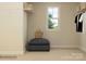 Bright closet with built-in shelves, overhead storage, and an ottoman for convenience at 3823 Horsham St, Indian Land, SC 29707