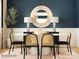 Contemporary dining room with a round table, unique lighting, and elegant decor at 3823 Horsham St, Indian Land, SC 29707