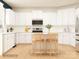 Modern kitchen with white cabinetry, stainless steel appliances, and a center island at 3823 Horsham St, Indian Land, SC 29707
