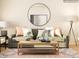 Inviting living room featuring a comfortable sofa, a round mirror and modern decor at 3823 Horsham St, Indian Land, SC 29707
