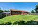 Expansive backyard featuring a well-maintained lawn, wooden fence, and a patio area, ideal for outdoor enjoyment at 4128 River Run Cir, Hickory, NC 28602