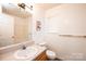 Bathroom with single vanity and shower-tub combination at 4128 River Run Cir, Hickory, NC 28602