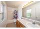 A bathroom features double sinks and a shower/tub at 4128 River Run Cir, Hickory, NC 28602