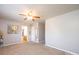 A carpeted bedroom shows doorways and a ceiling fan at 4128 River Run Cir, Hickory, NC 28602