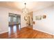 Inviting dining space with hardwood flooring, stylish light fixture, and lots of natural light at 4128 River Run Cir, Hickory, NC 28602