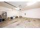A spacious garage has a white door and concrete floors at 4128 River Run Cir, Hickory, NC 28602