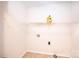 Simple laundry room with tile floors, shelving for storage, and washer/dryer hookups at 4128 River Run Cir, Hickory, NC 28602