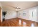 Bright living room with hardwood floors, neutral walls, ceiling fan, and a charming window seat at 4128 River Run Cir, Hickory, NC 28602