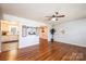 Comfortable living room features gleaming hardwood floors and a soothing color palette at 4128 River Run Cir, Hickory, NC 28602