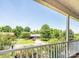 Scenic view from the porch overlooking a quiet neighborhood with mature trees and well-kept homes at 4128 River Run Cir, Hickory, NC 28602