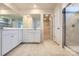 Bathroom featuring double vanity, spacious mirror, neutral color palette, and a glass-enclosed shower at 4178 Skyboat Cir, Fort Mill, SC 29715