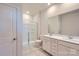 Bright bathroom featuring a double vanity, walk-in shower, neutral paint, and tiled floors at 4178 Skyboat Cir, Fort Mill, SC 29715