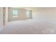 Spacious bedroom with neutral carpet, bright windows, and ample natural light at 4178 Skyboat Cir, Fort Mill, SC 29715