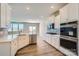 Modern kitchen with stainless steel appliances, white cabinetry, granite countertops and hardwood floors at 4178 Skyboat Cir, Fort Mill, SC 29715