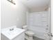 Bathroom featuring a tub-shower, sink, and toilet, with neutral walls and gray flooring at 426 Williamson St, Rock Hill, SC 29730