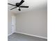 Bedroom featuring neutral walls, grey floors, a modern ceiling fan, and a white door at 426 Williamson St, Rock Hill, SC 29730