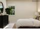 Relaxing bedroom featuring black dresser and a large window at 4263 Skyboat Cir, Fort Mill, SC 29715