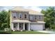 Charming two-story brick home featuring a manicured lawn, flowerbeds, and a two-car garage at 4263 Skyboat Cir, Fort Mill, SC 29715
