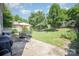 Green backyard featuring a patio with outdoor seating and a built-in grill at 4732 Meadowfield Rd # L35, Charlotte, NC 28215