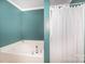 Bright bathroom features a soaking tub and shower at 4732 Meadowfield Rd # L35, Charlotte, NC 28215