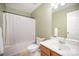 Clean bathroom with a shower-tub combo, white fixtures, and a medicine cabinet mirror at 4732 Meadowfield Rd # L35, Charlotte, NC 28215