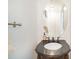 Elegant half-bath includes a stylish mirror, detailed vanity, and modern fixtures at 4732 Meadowfield Rd # L35, Charlotte, NC 28215