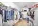 Walk-in closet with ample shelving and hanging storage at 4732 Meadowfield Rd # L35, Charlotte, NC 28215