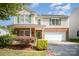 Charming two-story home featuring green shutters, brick accents, and a well-manicured front yard at 4732 Meadowfield Rd # L35, Charlotte, NC 28215