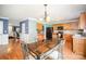 This kitchen showcases warm cabinetry, modern appliances, and a functional layout for culinary enthusiasts and entertainers alike at 4732 Meadowfield Rd # L35, Charlotte, NC 28215