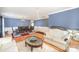 Spacious living room view to dining room, chair rail molding, hardwood floors, bright and airy at 4732 Meadowfield Rd # L35, Charlotte, NC 28215