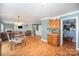 Open floor plan connects the kitchen, dining area, and living room, creating a spacious and inviting atmosphere at 4732 Meadowfield Rd # L35, Charlotte, NC 28215