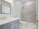 Modern bathroom with a gray vanity, walk-in shower with mosaic tile and white marble floors at 500 Landau Rd, Waxhaw, NC 28173