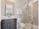 Modern bathroom featuring a glass-enclosed shower, sleek vanity, and contemporary fixtures at 500 Landau Rd, Waxhaw, NC 28173