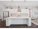 Contemporary white kitchen featuring a spacious island, modern pendant lighting and stainless appliances at 500 Landau Rd, Waxhaw, NC 28173