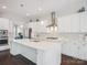 Bright, modern kitchen with white cabinets, stainless steel appliances, and a large center island at 500 Landau Rd, Waxhaw, NC 28173