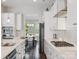 Modern kitchen featuring white cabinets, stainless steel appliances, and an open layout at 500 Landau Rd, Waxhaw, NC 28173