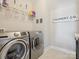 Bright laundry room features modern appliances, neutral walls, and light floors at 500 Landau Rd, Waxhaw, NC 28173