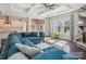 Spacious living room with a coffered ceiling, stone fireplace, and large windows at 500 Landau Rd, Waxhaw, NC 28173