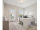 Office area includes a large desk, natural light, and neutral paint at 500 Landau Rd, Waxhaw, NC 28173