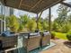 Outdoor patio featuring comfortable seating, manicured landscaping, and a private lawn at 500 Landau Rd, Waxhaw, NC 28173