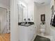 Bathroom with dark countertop, big mirror, and tile flooring at 5572 Yorke Nw St, Concord, NC 28027