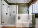 Primary bathroom features hardwood flooring, soaker tub, walk-in shower, and a decorative chandelier at 5572 Yorke Nw St, Concord, NC 28027
