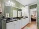Bathroom with a double vanity, granite countertop and view into the main bedroom at 5572 Yorke Nw St, Concord, NC 28027