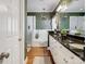 Primary bathroom features hardwood flooring, soaker tub, granite countertop, and walk-in shower at 5572 Yorke Nw St, Concord, NC 28027