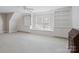 Bright bedroom featuring built-in shelving, window seat, and plenty of natural light at 5572 Yorke Nw St, Concord, NC 28027