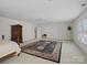 Large bedroom with neutral walls, furniture, and big rug at 5572 Yorke Nw St, Concord, NC 28027