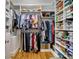 Walk-in closet with custom shelving and ample storage for clothes, shoes, and accessories at 5572 Yorke Nw St, Concord, NC 28027