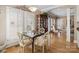 Bright dining room features ample natural light, a glass table, and elegant neutral decor at 5572 Yorke Nw St, Concord, NC 28027